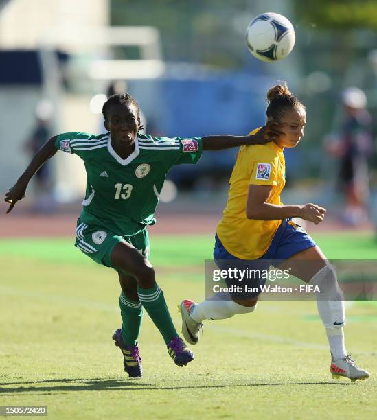 Fasilat Adeyeno of Nigeria competes for the ball with Thais Guedes of Brazil during the FIFA U-20 Women's World Cup Japan 2012, Group B match between...