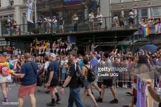 Large crowd watches the NYC Pride March 2023 on 5th Avenue, between 23rd and 22nd Streets, in the Flatiron district of Manhattan, New York City. More...