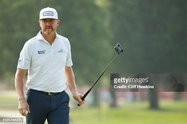 Jimmy Walker of the United States walks off the 17th green during the second round of the Rocket Mortgage Classic at Detroit Golf Club on June 30,...