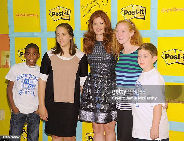 Debra Messing with students attends the Post-It Your Words Stick With Them Program Launch at PS 15 Roberto Clemente Elementary School on August 22,...