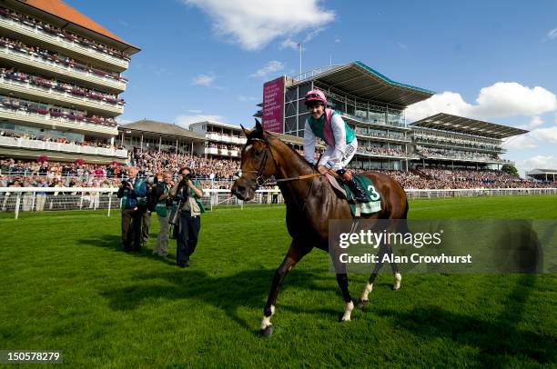 Tom Queally smiles after riding Frankel to victory in The Juddmonte International Stakes at York racecourse on August 22, 2012 in York, England.