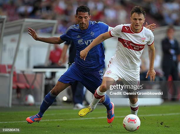 Kevin Kuranyi of Moscow and William Kvist of Stuttgart battle for the ball during the UEFA Europa League Qualifying Play-Off match between VfB...