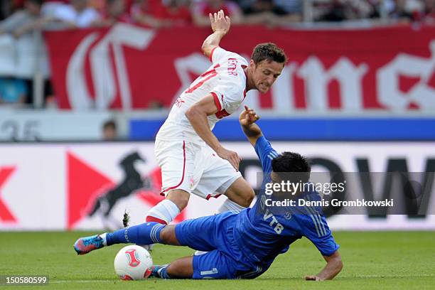 Christian Gentner of Stuttgart challenges Christian Noboa of Moscow during the UEFA Europa League Qualifying Play-Off match between VfB Stuttgart and...