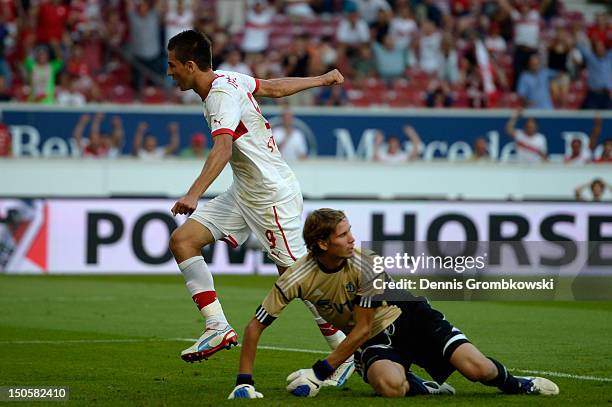 Vedad Ibisevic of Stuttgart celebrates after scoring his team's first goal during the UEFA Europa League Qualifying Play-Off match between VfB...