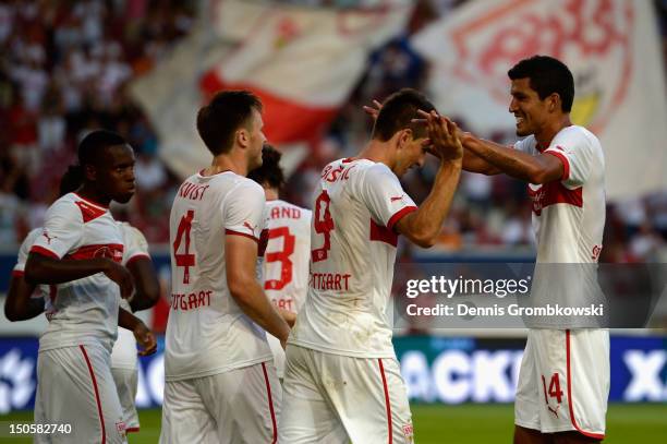 Vedad Ibisevic of Stuttgart celebrates with teammate Francisco Rodriguez after scoring his team's second goal during the UEFA Europa League...