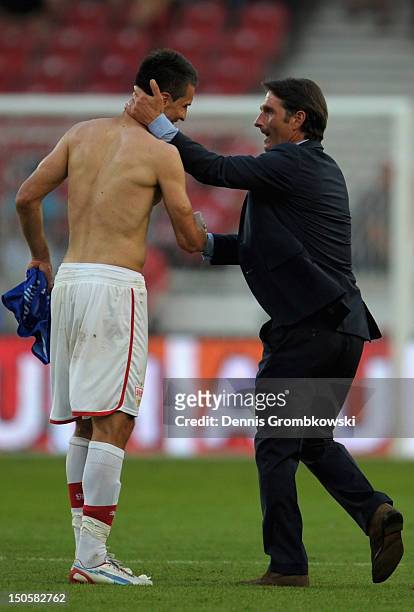 Head coach Bruno Labbadia of Stuttgart celebrates with Vedad Ibisevic after the UEFA Europa League Qualifying Play-Off match between VfB Stuttgart...