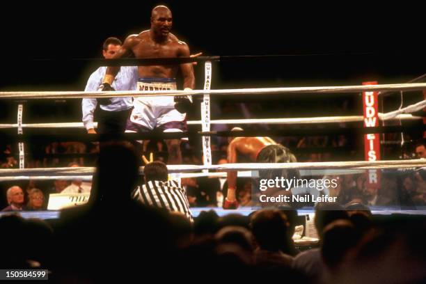 Heavyweight Title: Evander Holyfield being led away by referee Mitch Halpern after knockdown of Michael Moorer at Thomas & Mack Center. Las Vegas, NV...