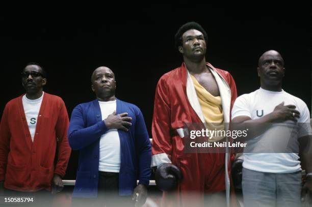 World Heavyweight Title: George Foreman with cornermen assistant trainer Sandy Saddler, trainer Dick Sadler, and personal advisor Doc Broadus during...