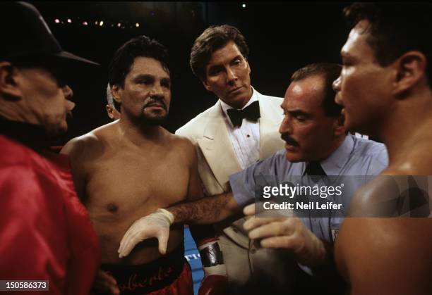 Super Middleweight Title: Roberto Duran and Vinny Pazienza with referee Steve Smoger as announcer Michael Buffer looks on before fight at Boardwalk...