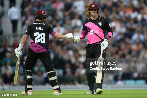 Tom Banton of Somerset celebrates reaching his half century with Tom Abell during the Vitality Blast T20 match between Surrey CCC and Somerset CCC at...