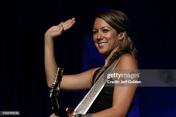 Colbie Caillat smiles and waves to the crowd as she walks on stage to perform at The Greek Theatre on August 19, 2012 in Los Angeles, California.