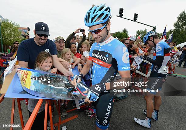 David Zabriskie of the United States riding for Garmin-Sharp signs autographs prior to the start of Stage Three of the USA Pro Challenge from...