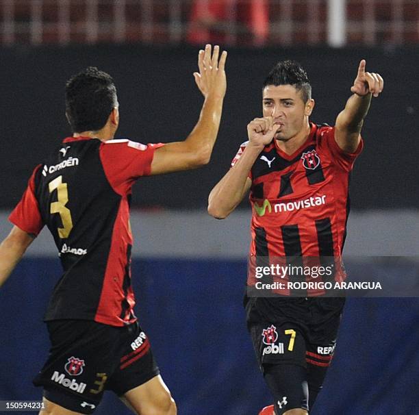 Alajuelense's Diego Calvo celebrates after scoring against Tigres of Mexico during their Concacaf Champion League at the Alejandro Morera Soto...