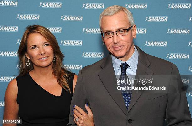 Addiction specialist Dr. Drew Pinsky and his wife Susan Pinsky arrive at The Substance Abuse And Mental Health Services Administration 2012 Voice...
