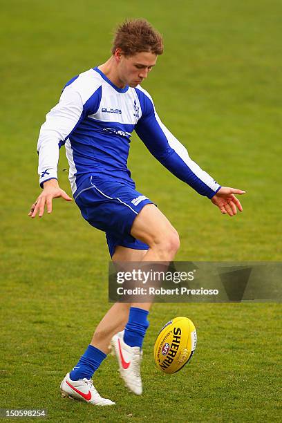 Kieran Harper kicks during a North Melbourne Kangaroos AFL training session at Aegis Park on August 23, 2012 in Melbourne, Australia.