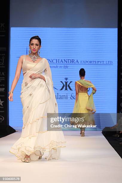Model walks the runway in a Saboo Fine Jewels Jewellery design at the India International Jewellery Week 2012 Day 4 at the Grand Hyatt on August 22,...