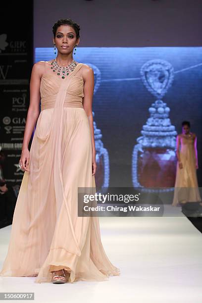 Model walks the runway in a Saboo Fine Jewels Jewellery design at the India International Jewellery Week 2012 Day 4 at the Grand Hyatt on August 22,...