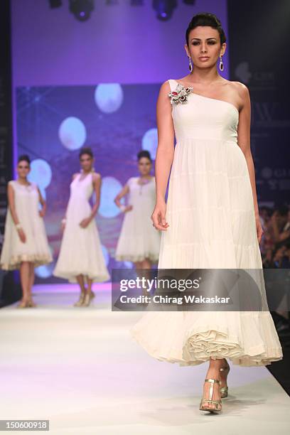 Model walks the runway in a Saboo Fine Jewels Jewellery design at the India International Jewellery Week 2012 Day 4 at the Grand Hyatt on August 22,...