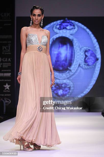 Model walks the runway in a Saboo Fine Jewels Jewellery design at the India International Jewellery Week 2012 Day 4 at the Grand Hyatt on August 22,...