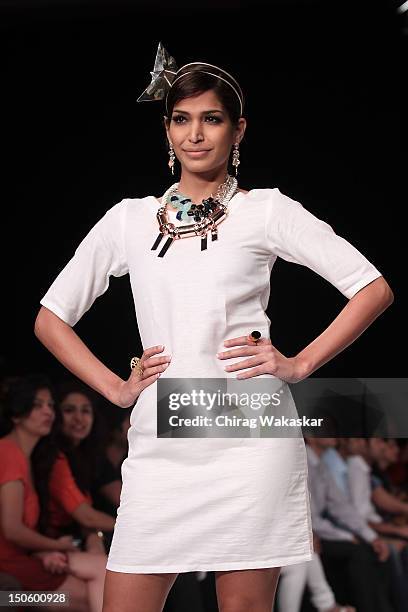 Model walks the runway in a Aavriti Jain - Daspan Jewellery design at the India International Jewellery Week 2012 Day 4 at the Grand Hyatt on August...