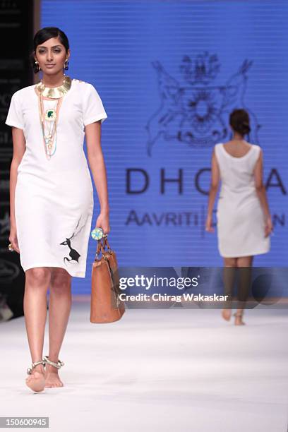 Model walks the runway in a Aavriti Jain - Daspan Jewellery design at the India International Jewellery Week 2012 Day 4 at the Grand Hyatt on August...