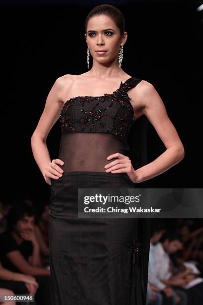 Model walks the runway in a Manish Khattar Jewellery design at the India International Jewellery Week 2012 Day 4 at the Grand Hyatt on August 22,...