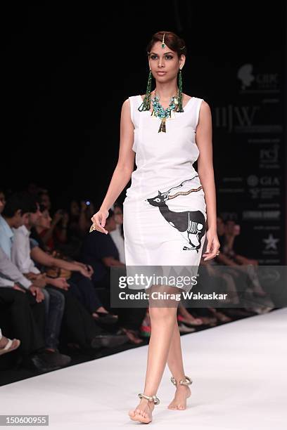 Model walks the runway in a Aavriti Jain - Daspan Jewellery design at the India International Jewellery Week 2012 Day 4 at the Grand Hyatt on August...