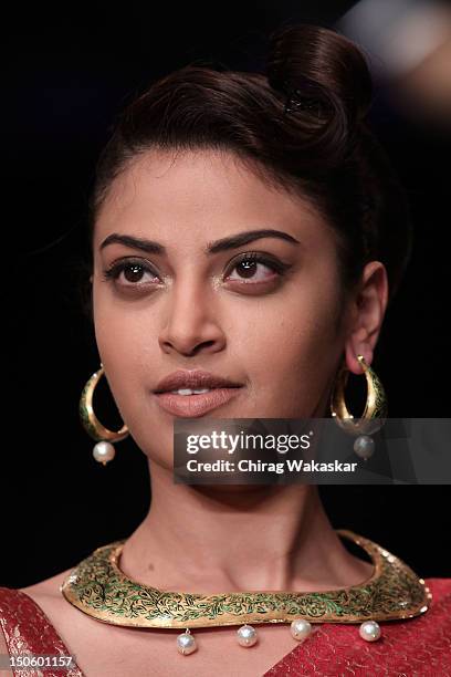 Model walks the runway in a Raksha Entp Jewellery design at the India International Jewellery Week 2012 Day 4 at the Grand Hyatt on August 22, 2012...