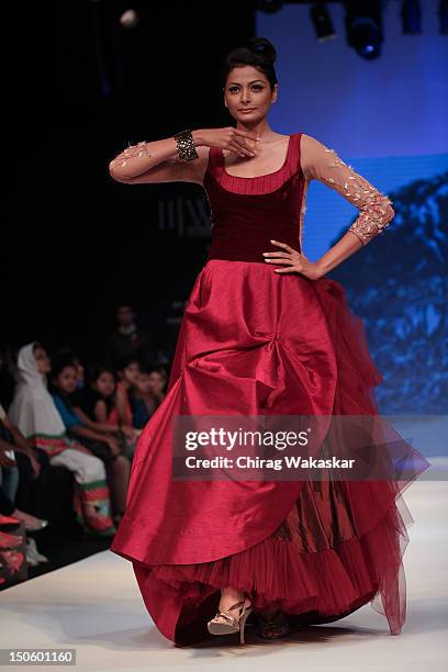 Model walks the runway in a Raksha Entp Jewellery design at the India International Jewellery Week 2012 Day 4 at the Grand Hyatt on August 22, 2012...