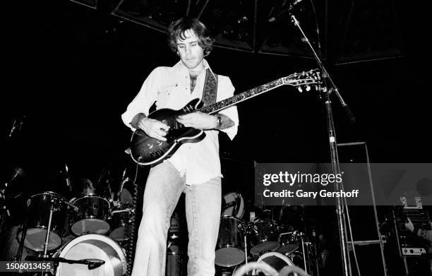 American Rock musician Bob Weir, of the group Grateful Dead, plays an electric guitar as he performs onstage at Nassau Coliseum , Uniondale, New...