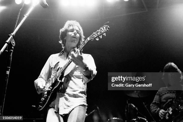 American Rock musician Bob Weir, of the group Grateful Dead, plays an electric guitar as he performs onstage at Nassau Coliseum , Uniondale, New...