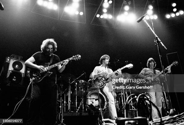 View of, from left, American Rock musicians Jerry Garcia and Bob Weir, both on guitar, and Phil Lesh, on bass guitar, all of the group Grateful Dead,...