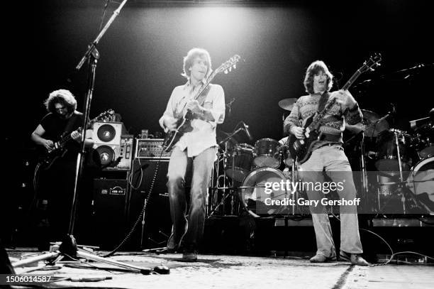 View of, from left, American Rock musicians Jerry Garcia and Bob Weir, both on guitar, and Phil Lesh, on bass guitar, all of the group Grateful Dead,...