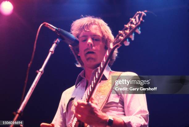 American Rock musician Bob Weir, of the group Grateful Dead, plays an electric guitar as he performs onstage at Nassau Coliseum , Uniondale, New...