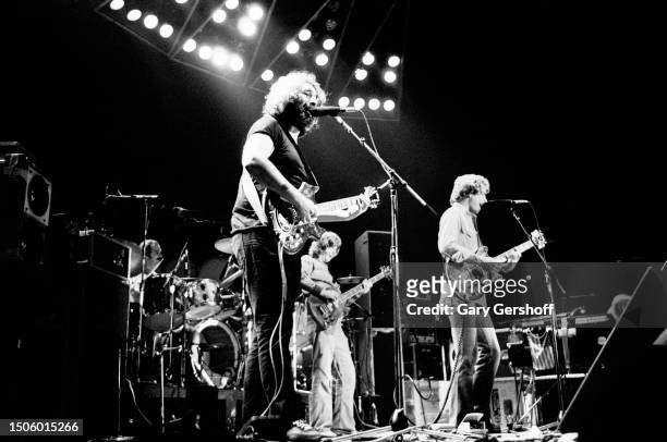 American Rock musician Jerry Garcia , of the group Grateful Dead, plays an electric guitar as he performs onstage at Nassau Coliseum , Uniondale, New...