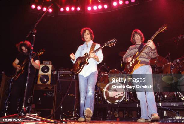 View of, from left, American Rock musicians Jerry Garcia and Bob Weir, both on guitar, and Phil Lesh, on bass guitar, all of the group Grateful Dead,...