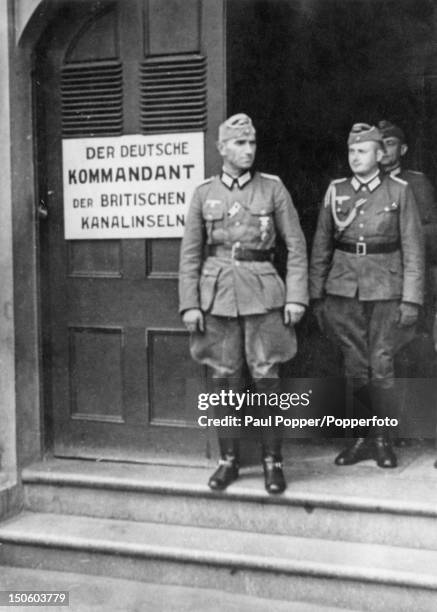 German officers outside the headquarters of the German Commandant of the British Channel Islands, Guernsey, circa 1943.