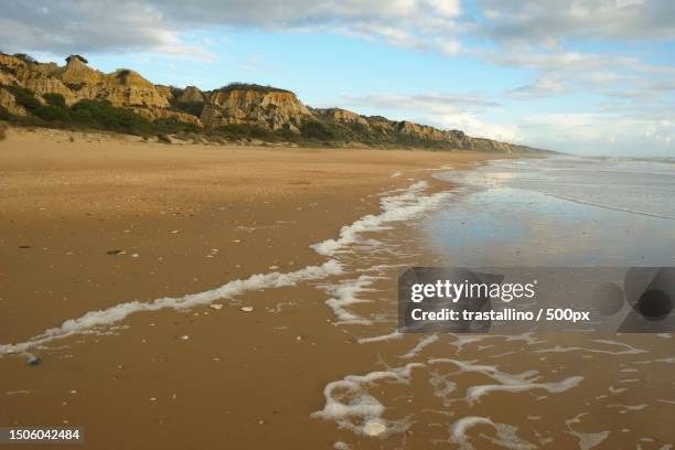 scenic view of beach against sky,huelva,spain - huelva province stock pictures, royalty-free photos & images