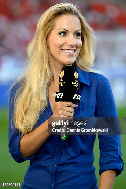 Presenter Andrea Kaiser smiles prior to the UEFA Europa League Qualifying Play-Off match between VfB Stuttgart and FC Dynamo Moscow at Mercedes-Benz...