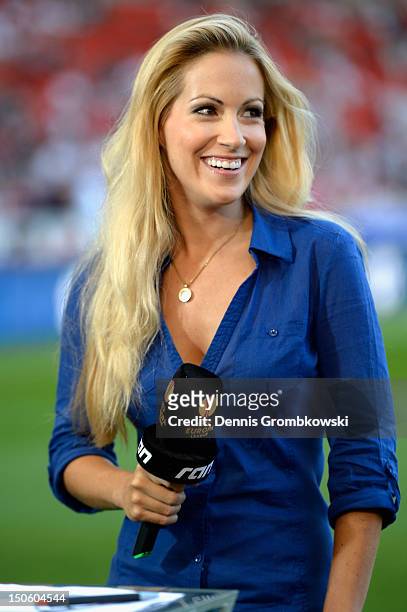 Presenter Andrea Kaiser smiles prior to the UEFA Europa League Qualifying Play-Off match between VfB Stuttgart and FC Dynamo Moscow at Mercedes-Benz...