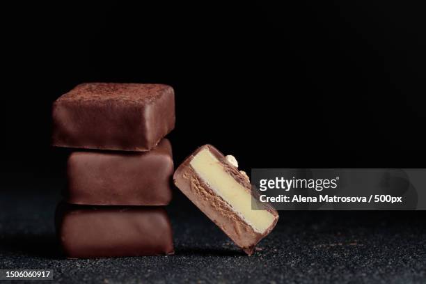 close-up of chocolate on black background,finland - nougat stock-fotos und bilder