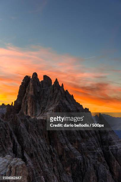 scenic view of rocky mountains against sky during sunset,cima undici,sesto,bolzano,italy - crepuscolo stock pictures, royalty-free photos & images
