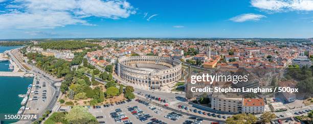 aerial view of cityscape against sky,pula,croatia - pula stock-fotos und bilder