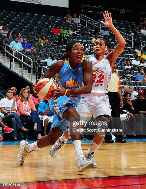 Eshaya Murphy of the Chicago Sky drives against Armintie Price of the Atlanta Dream at Philips Arena on August 22, 2012 in Atlanta, Georgia. NOTE TO...