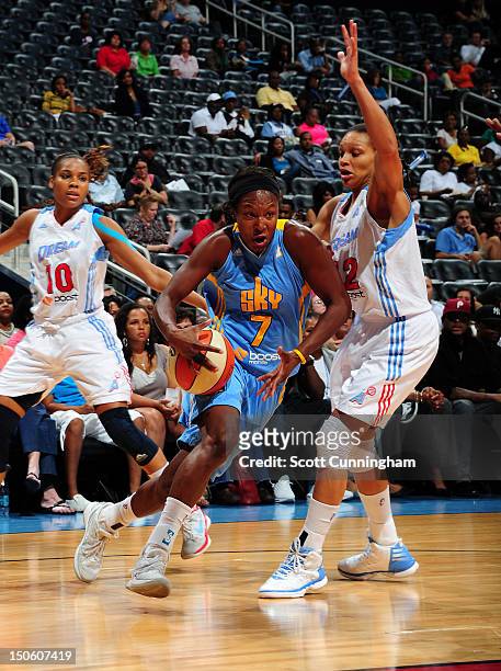 Eshaya Murphy of the Chicago Sky drives against Armintie Price of the Atlanta Dream at Philips Arena on August 22, 2012 in Atlanta, Georgia. NOTE TO...
