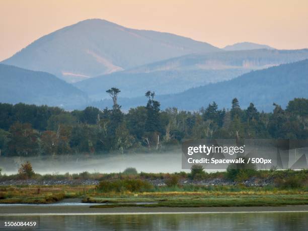 scenic view of lake and mountains against sky,cowichan bay,british columbia,canada - cowichan bay stock pictures, royalty-free photos & images
