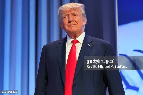 Republican presidential candidate former U.S. President Donald Trump takes the stage during the Moms for Liberty Joyful Warriors national summit at...
