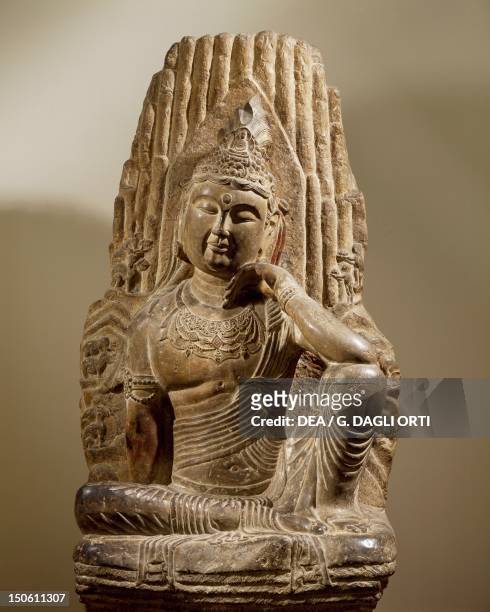 Bodhisattva Avalokiteshvara sitting on Mount Potalaka, limestone statue, China. Chinese Civilisation, Sung Dynasty, 10th-13th century.