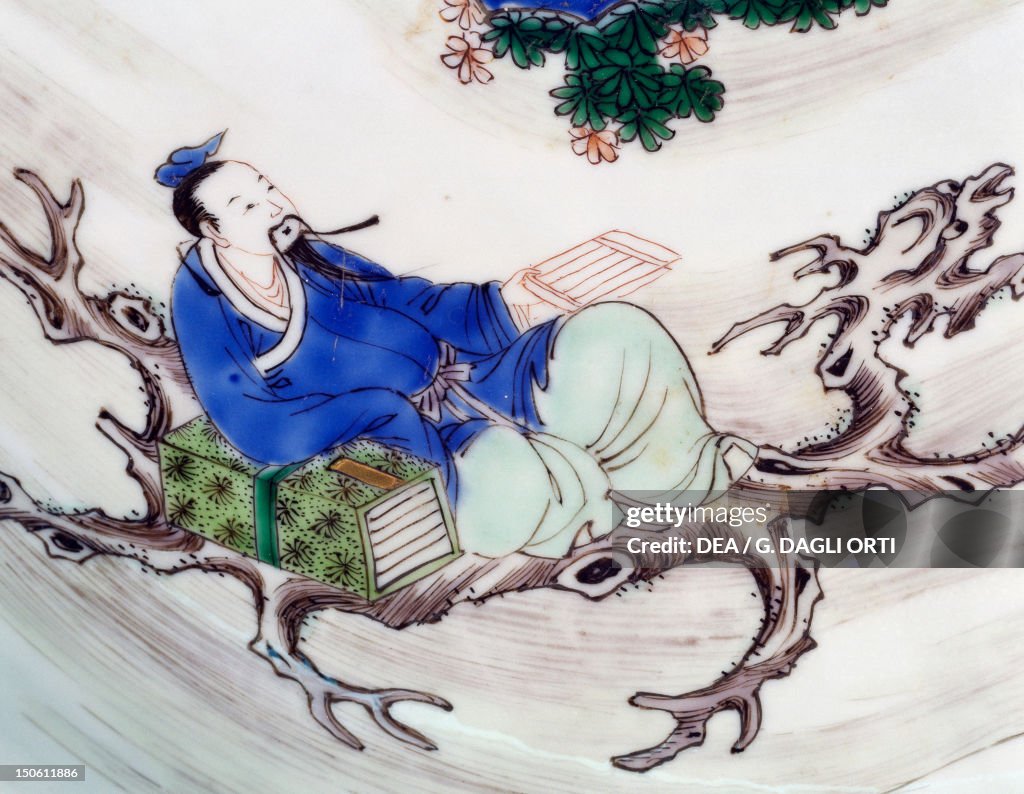 The poet Li Po sitting on a tree branch