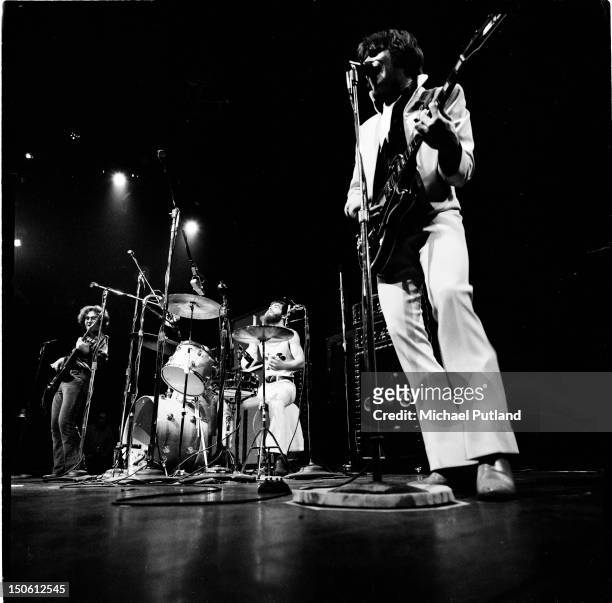 Creedence Clearwater Revival perform on stage at the Royal Albert Hall, London, 27th September 1971. Left to right: Stu Cook, Doug Clifford and John...